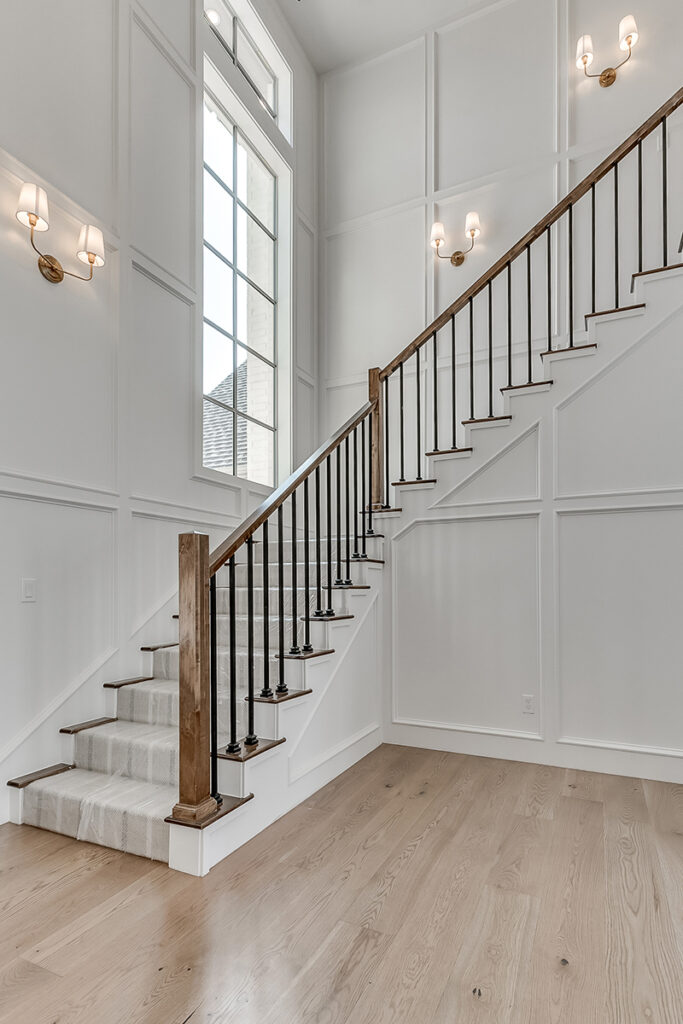 Elegant staircase design in a custom home by Huffman Custom Homes, an Oklahoma Home Builder.