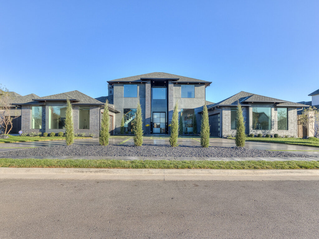 Striking modern home with symmetrical architecture and large glass windows