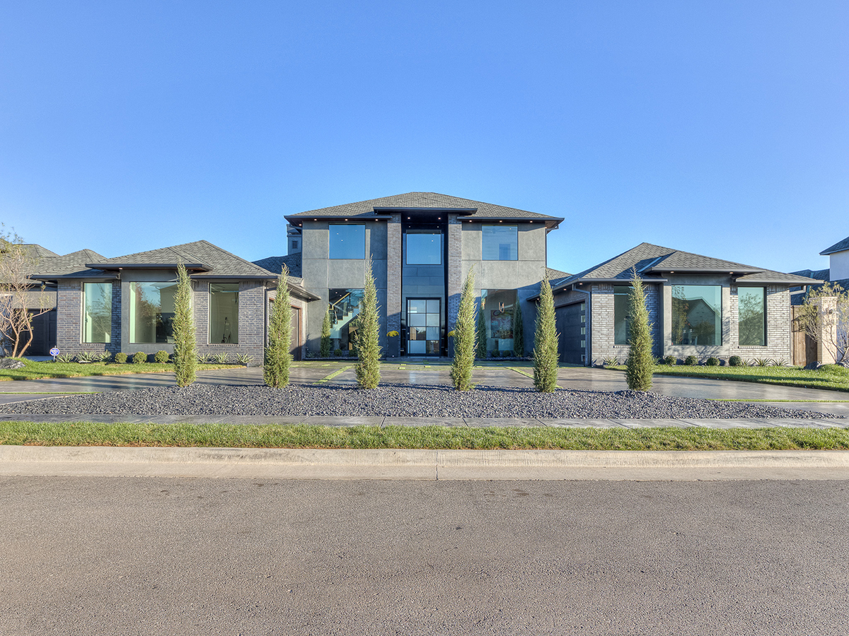 Striking modern home with symmetrical architecture and large glass windows