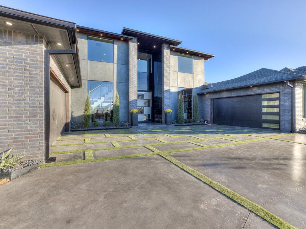 Modern home exterior with geometric driveway and sleek facade