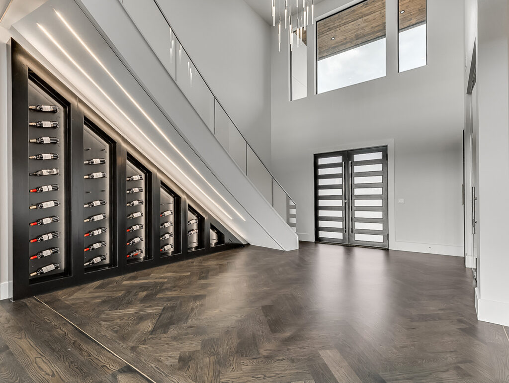 Grand entryway of a modern transitional home with under-stair wine storage