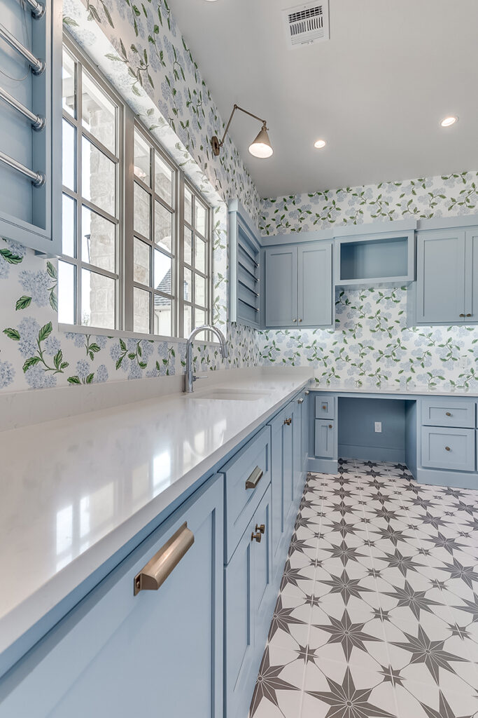 Custom laundry room with blue cabinetry in OKC homes
